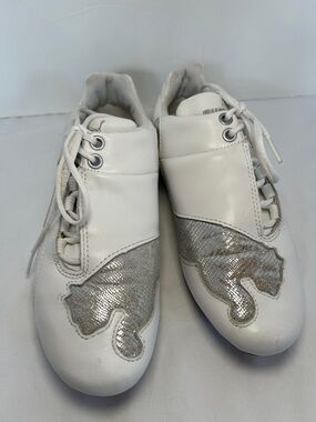 PUMA woman’s White Leather Athletic Sneakers with Metallic Accent